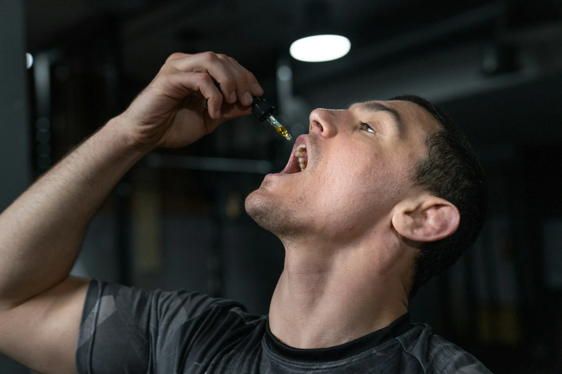 A guy drops CBD oil orally