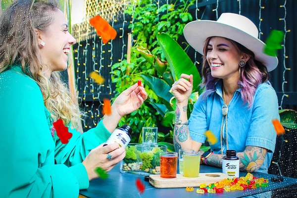An image of two girls embracing the Preekend lifestyle at an early Friday happy hour