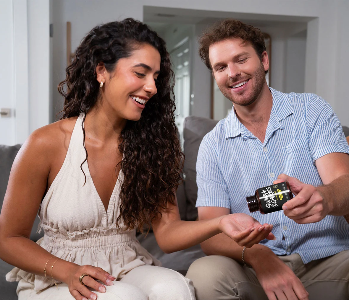 Hand holding CBD gummy