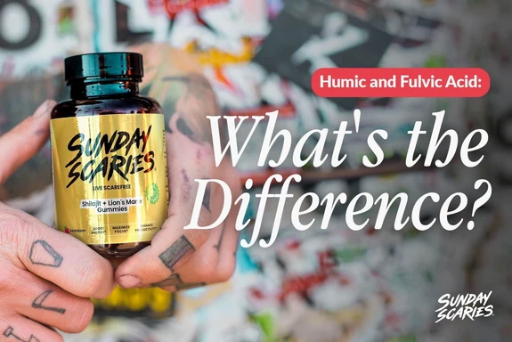 A guy with tattoos on his hands holds up a bottle of Sunday Scaries Shilajit gummies in front of a graffiti background. 
