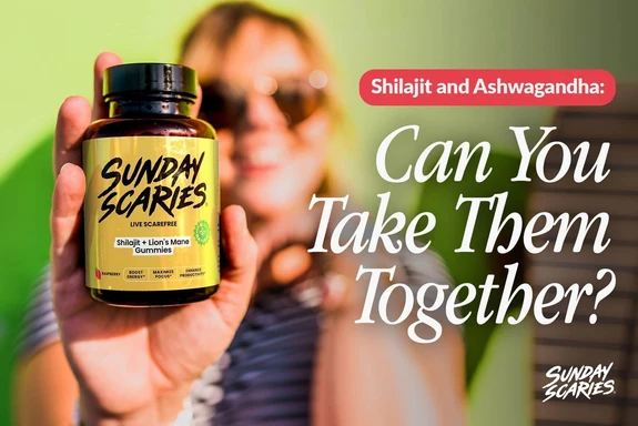 A woman with sunglasses on holds up a bottle of Sunday Scaries Shilajit gummies in front of a green background. 