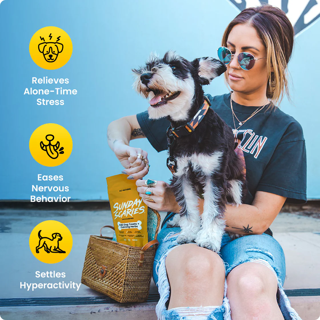 A woman with a dog in her lap opens a bad of Sunday Scaries dog calming treats with icons showing the benefits