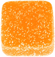 Orange square vegan gummy with a sugary texture on a white background